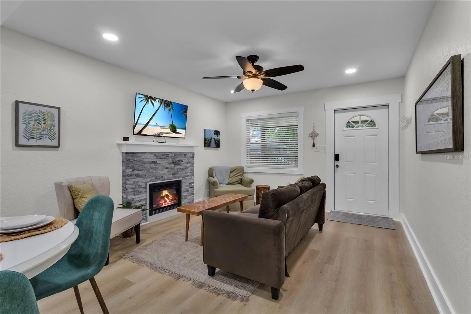 A warm, inviting living room with cozy charm and a relaxing feel welcomes you home.