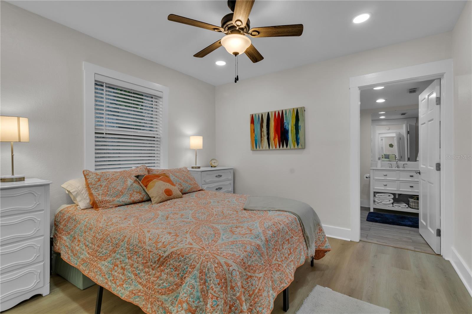 A light and airy primary bedroom with a private ensuite, offering a serene and relaxing retreat.