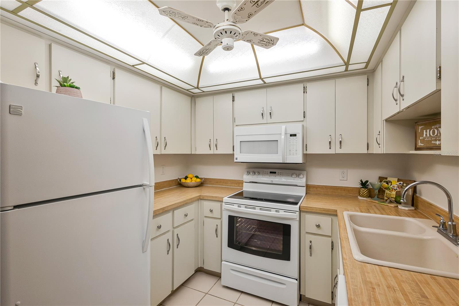 Kitchen with ceramic tile flooring and ceiling fan