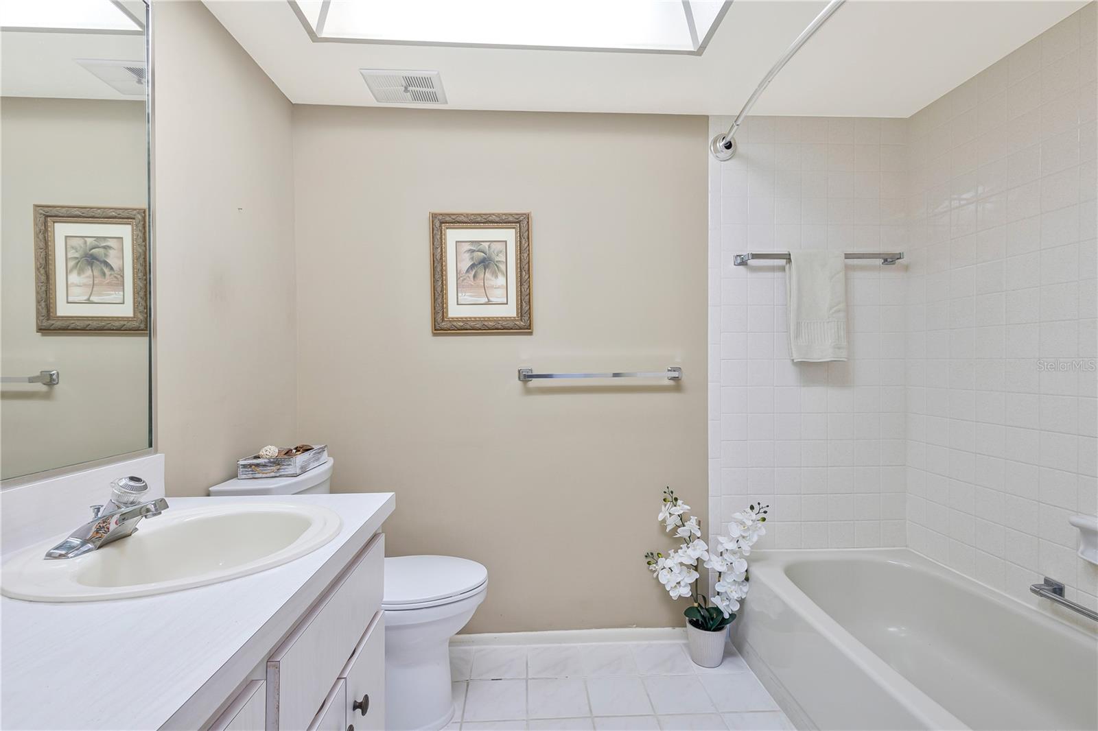 Guest bath also has a linen closet in the hallway.