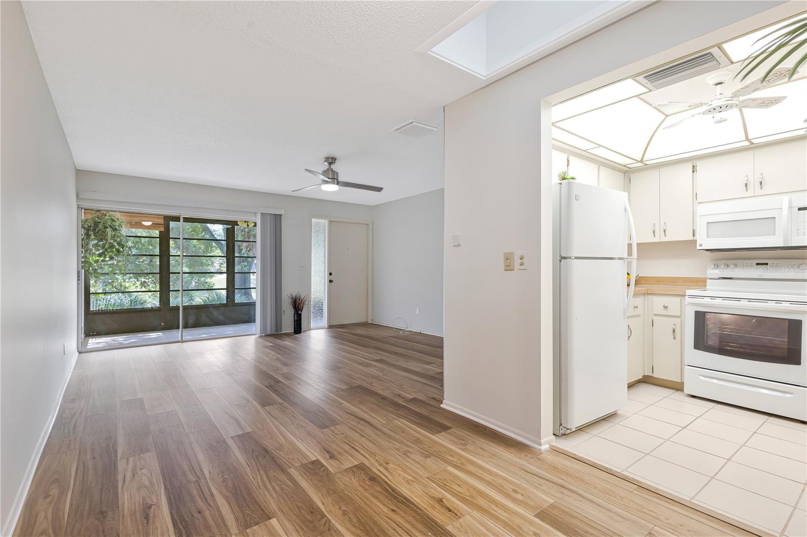 View from dining room looking towards sliding doors to enclosed porch