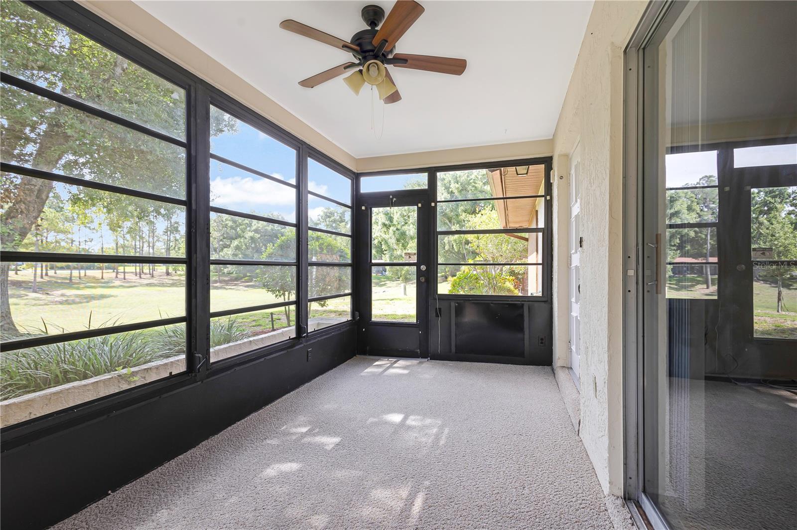 Front porch overlooking wide green belt