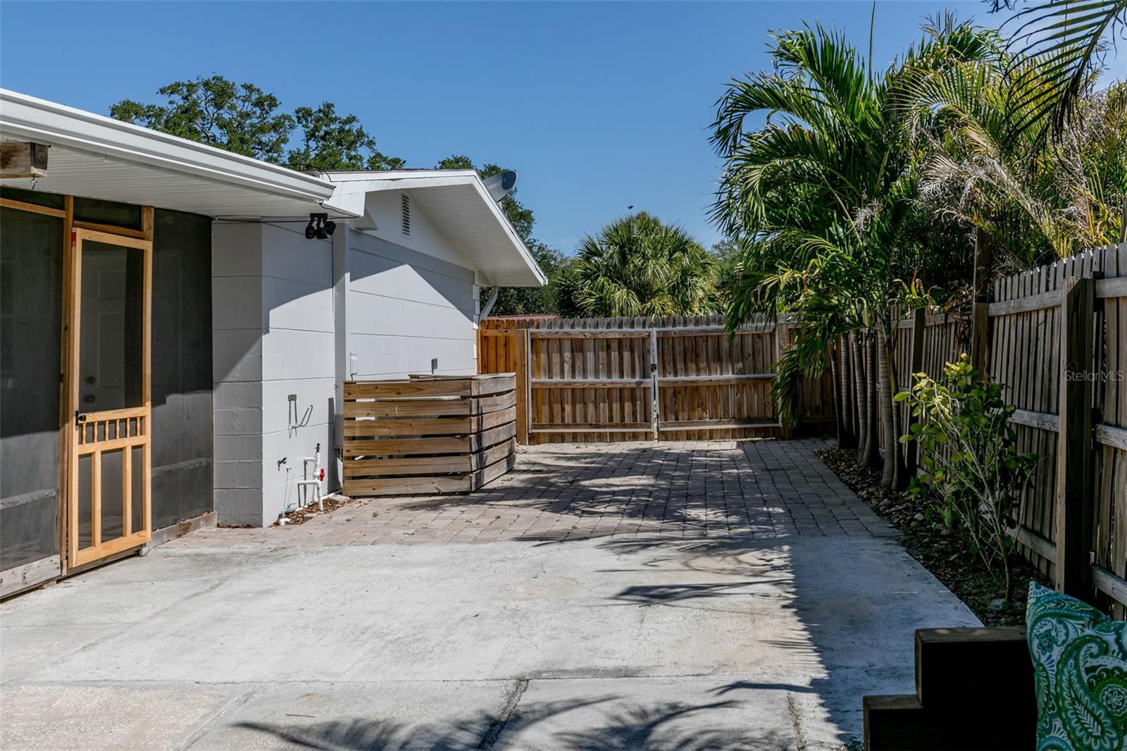 Side of home, with cement pad for additional vehicle or boat parking