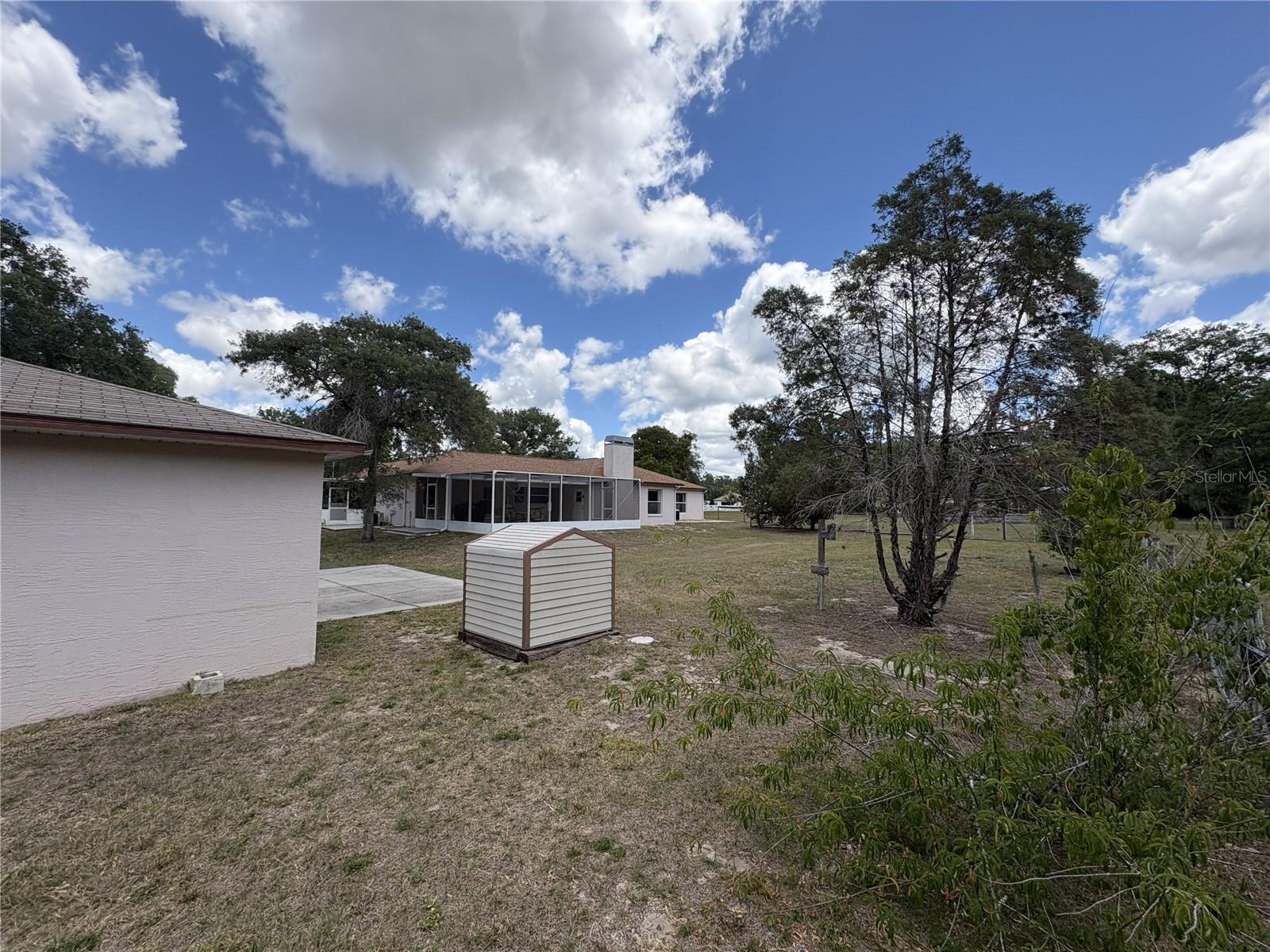 Back of detached garage view of house