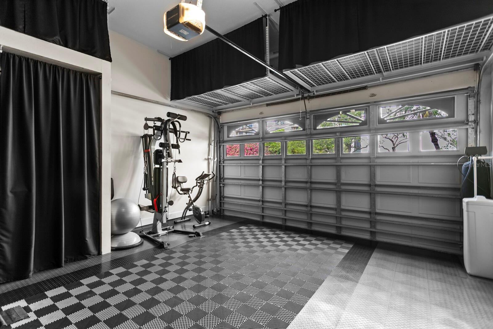 Garge with tons of storage and also used as a home gym