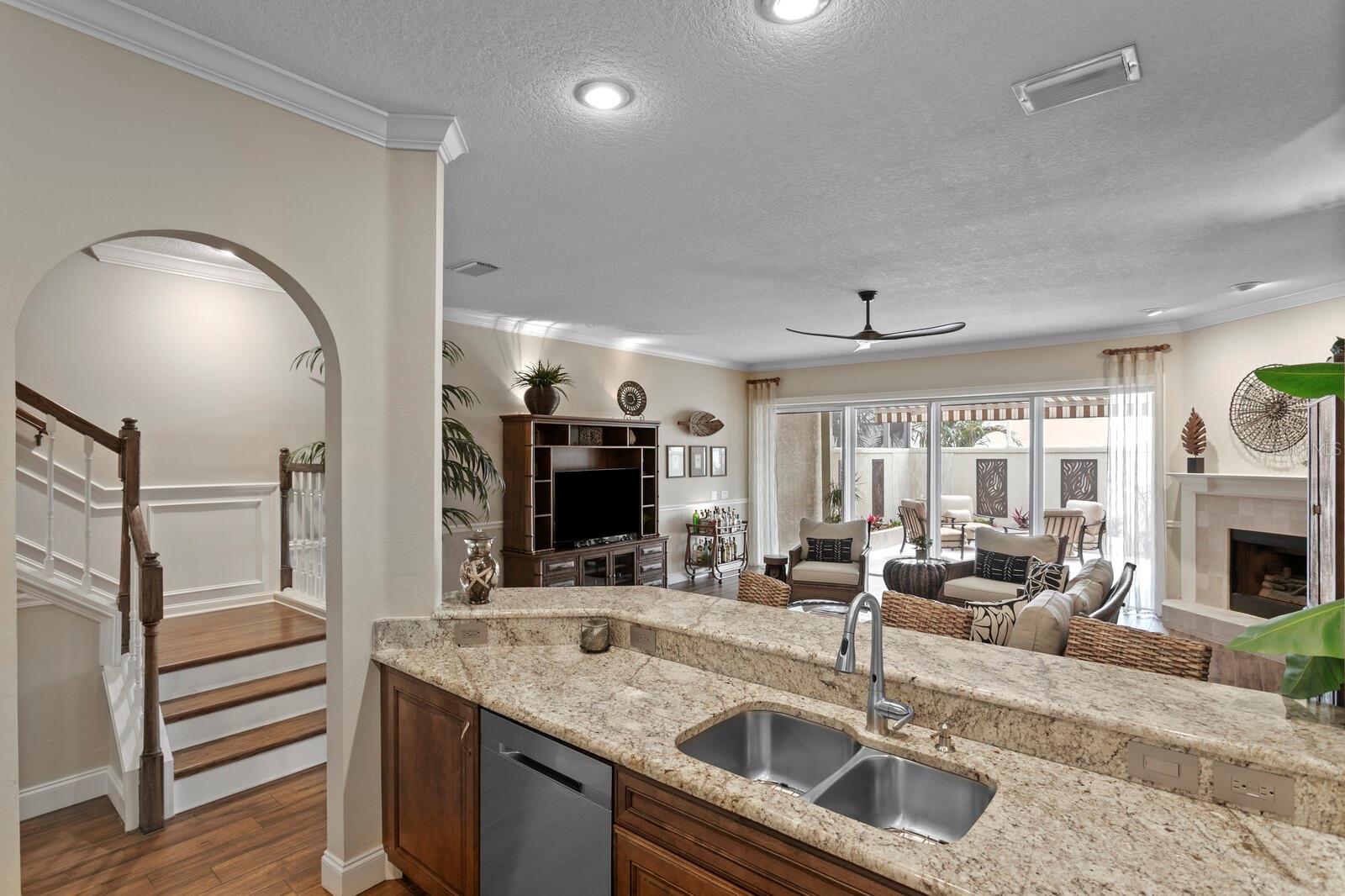 Kitchen with views of family room and private patio