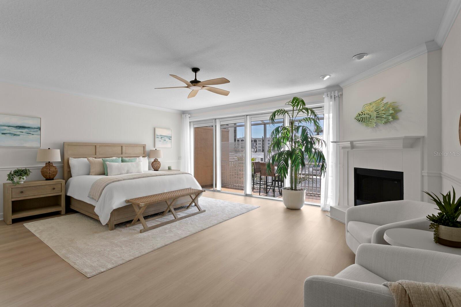 Large Primary suite with fireplace and sliders to private screened in balcony with water views
