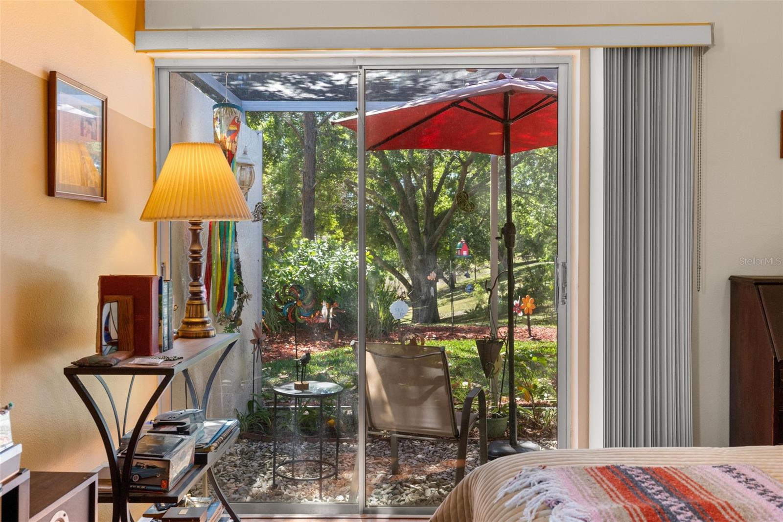 view of back yard from primary bedroom