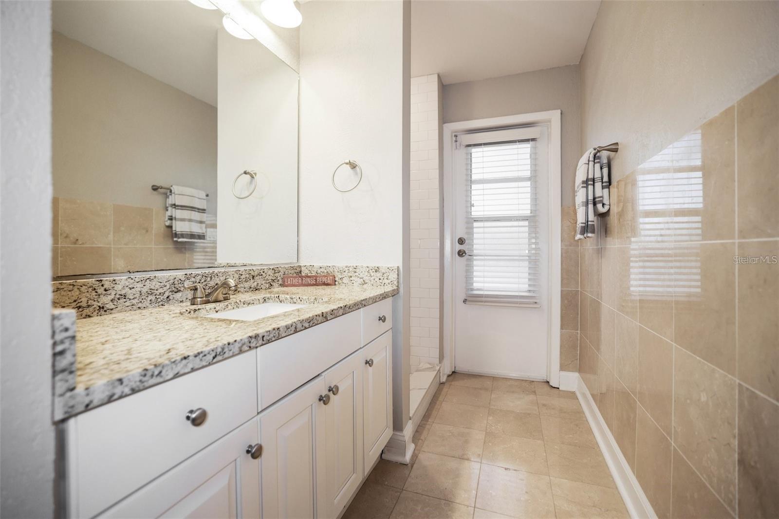 Third Bathroom leads to pool and in law bedroom