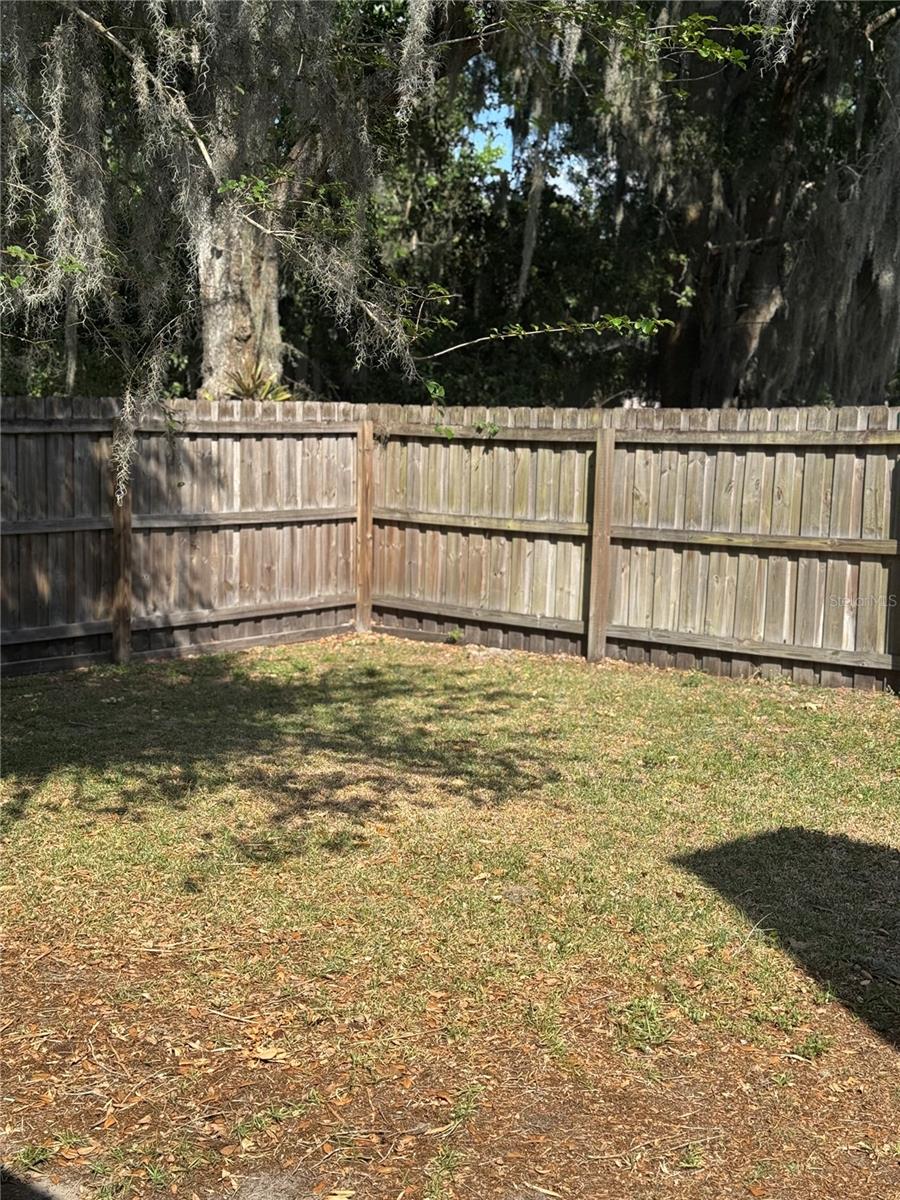 Oversized backyard is completely fenced