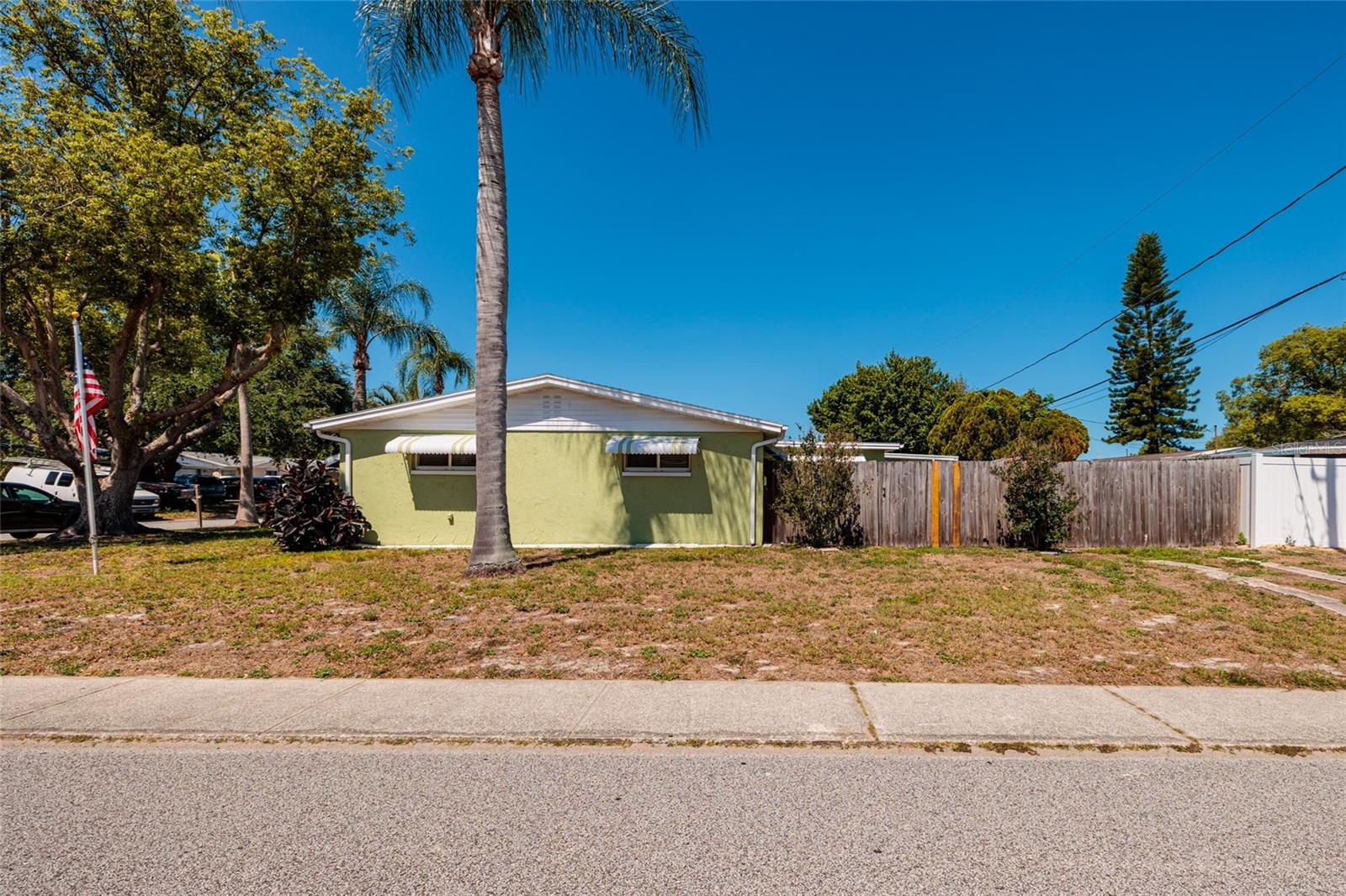 East Side Lot with Driveway Path to Gate