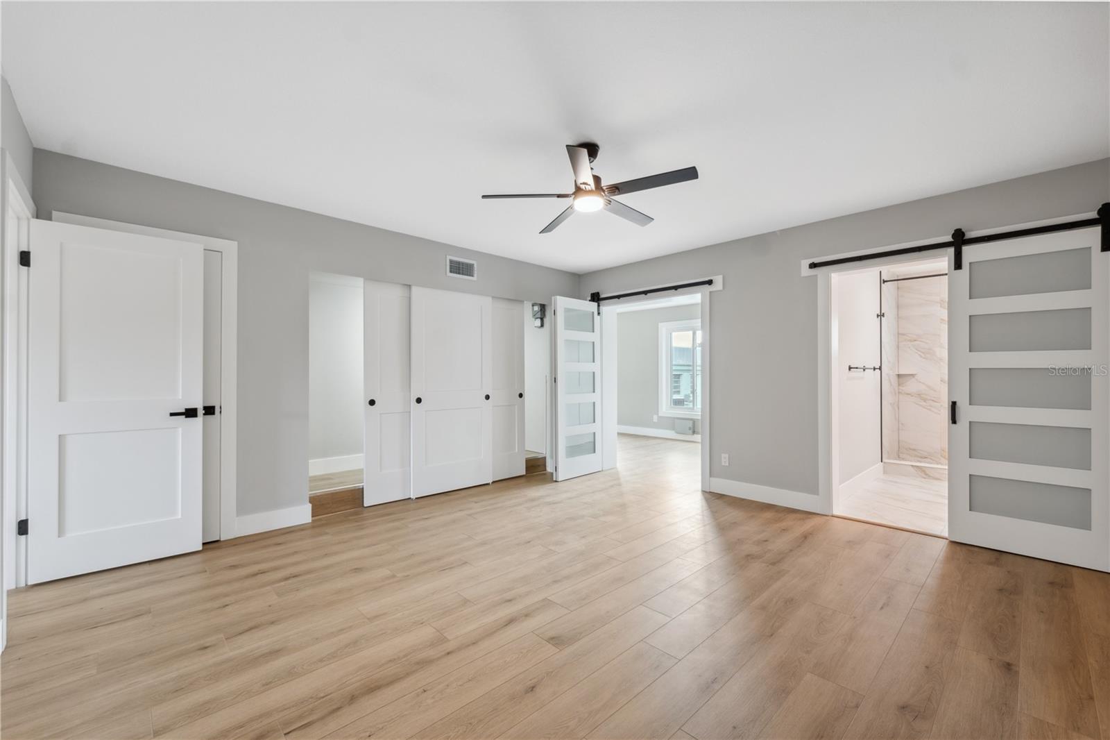 spacious master bedroom with large closets and luxurious ensuite bath