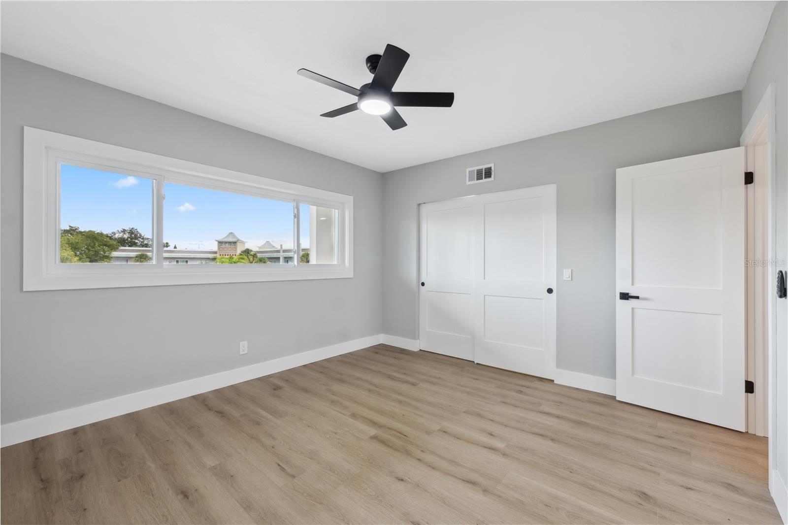 spacious second bedroom with large closets and new window