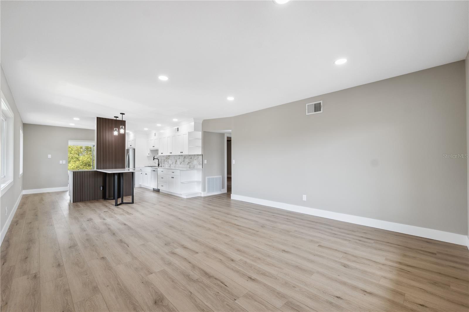 open spacious concept with eat in kitchen bar