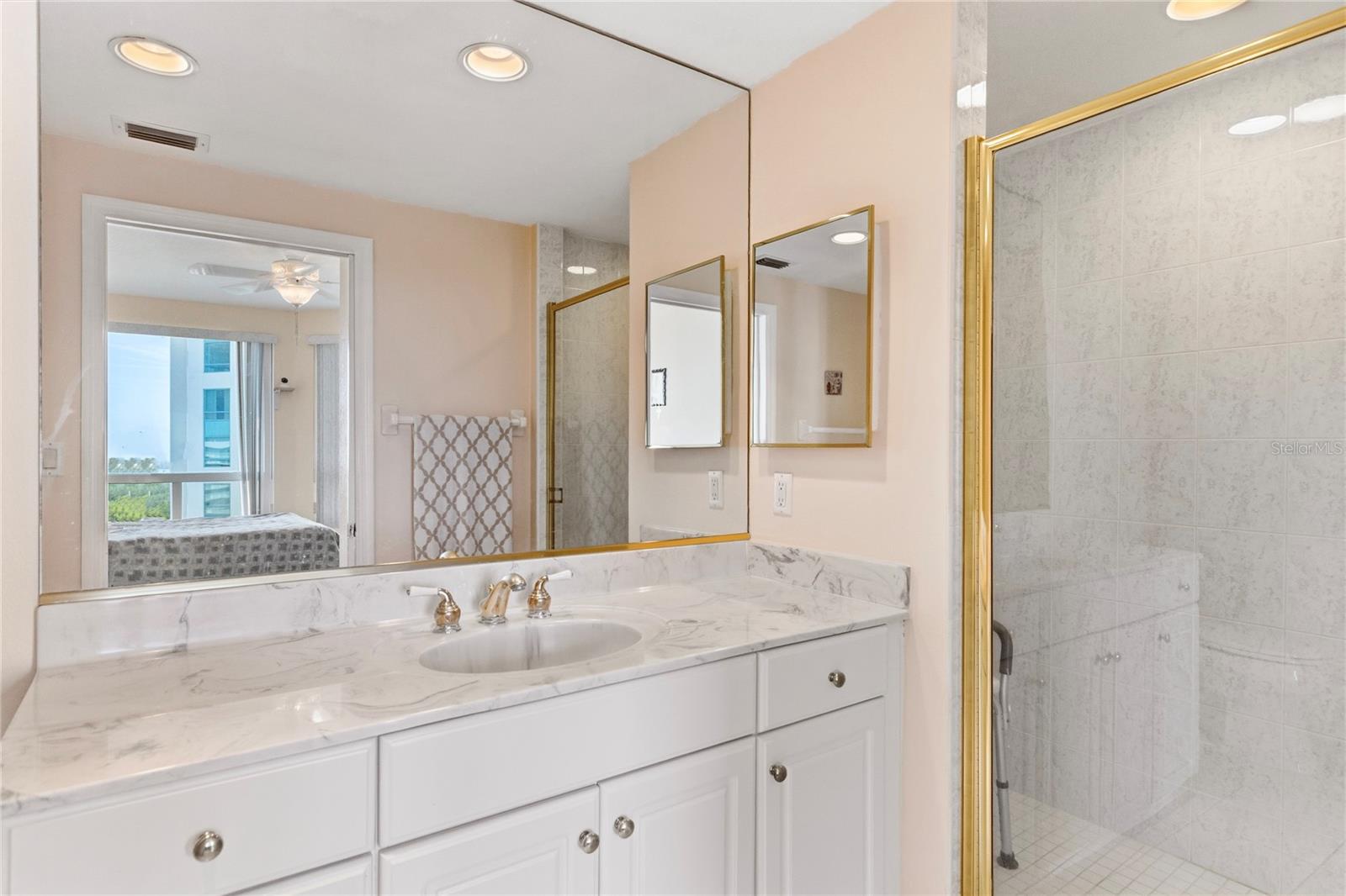 Full guest bathroom with a large shower.