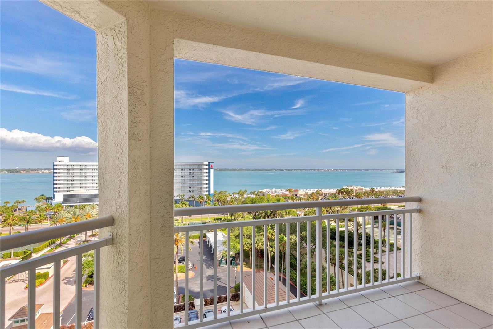 The balcony wraps around from intercoastal to Gulf views.
