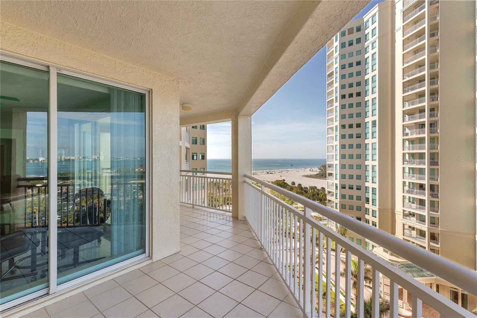 The balcony wraps around from intercoastal to Gulf views.