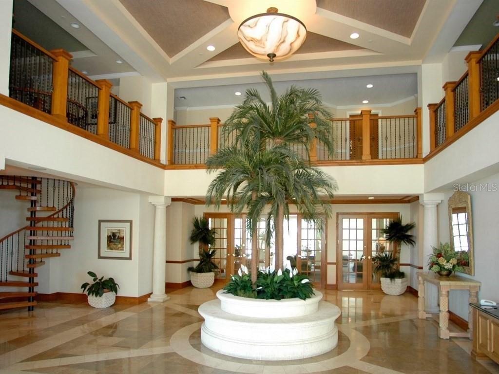 The Grande's grand reception area, with a reading room upstairs on your left, the grand salon ahead and the concierge station on your right.