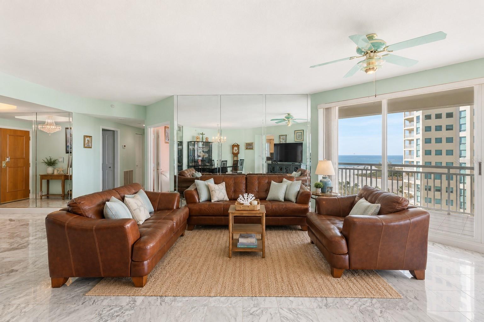 AI Staged Watch the boats idle by on the intercoastal waterway, or people strolling past on the Gulf.  Water views from every room.