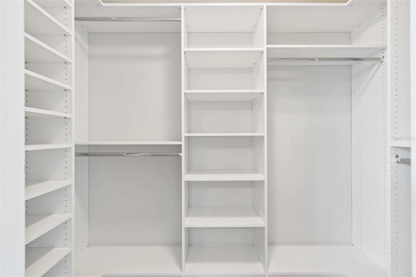 walk in closet with built in shelves