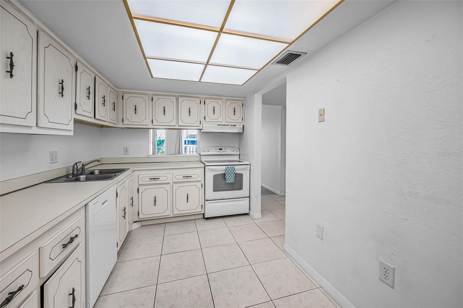 The Kitchen has a window opening into the Dining Area.