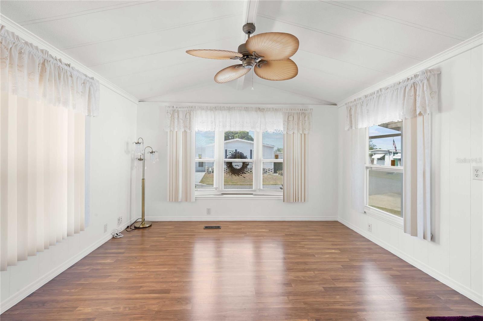 Ceiling fan and laminate flooring.