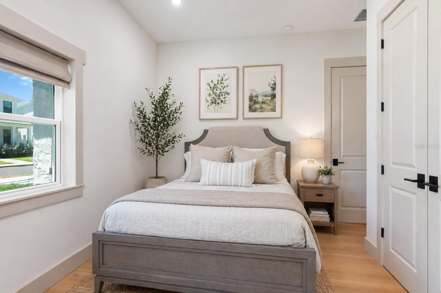 Digitally enhanced decor guest bedroom that connects to Jack and Jill bathroom