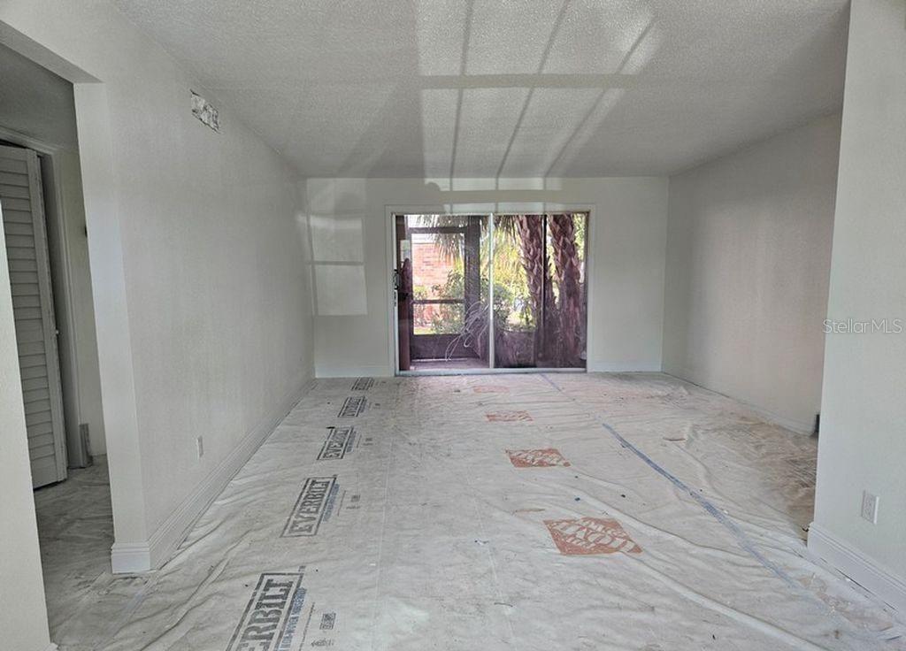 Living/Dining Room with sliders leading to screened porch