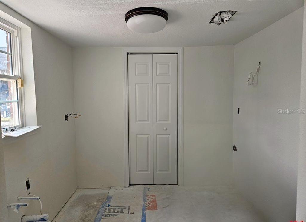 Kitchen with laundry closet for stackable washer/dryer & water heater