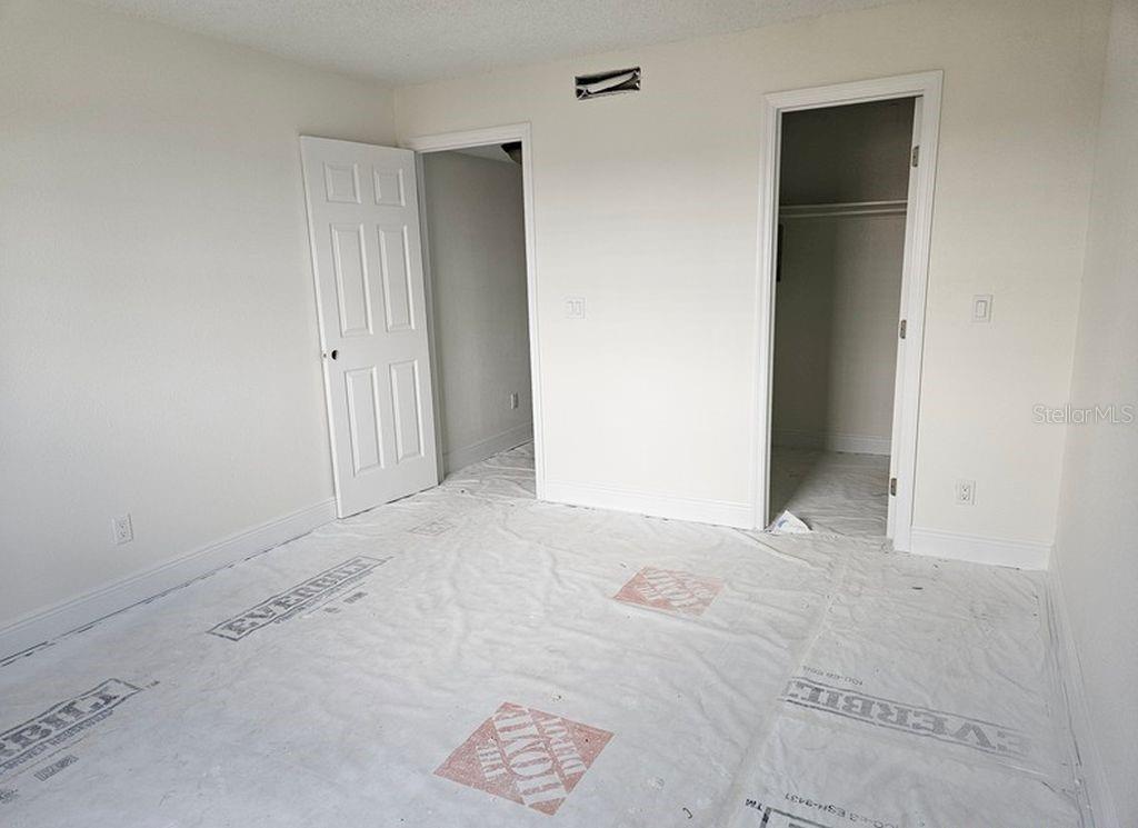 Bedroom with walk-in closet