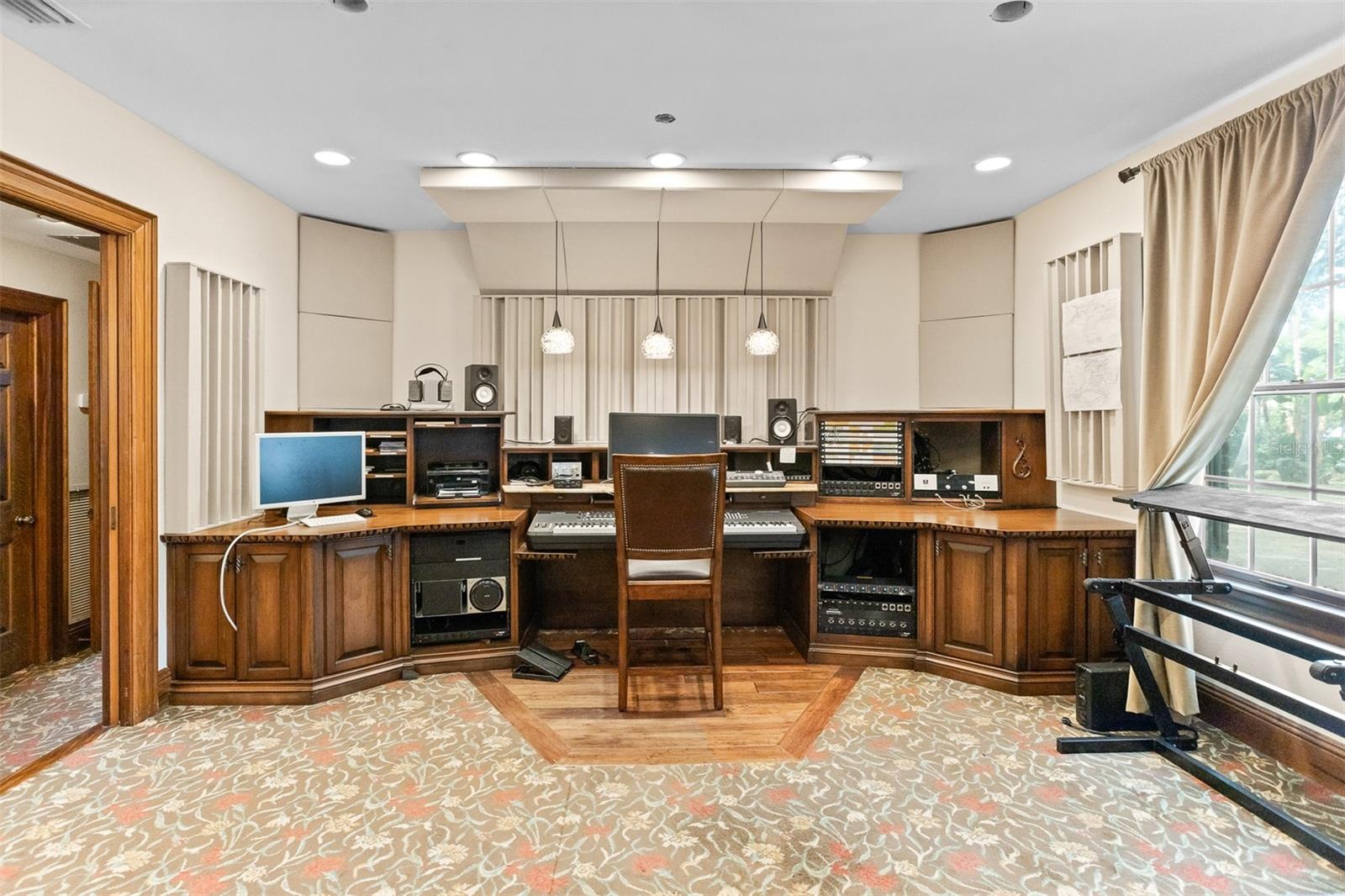 Grand piano on one side and magnificent recording studio on the other end