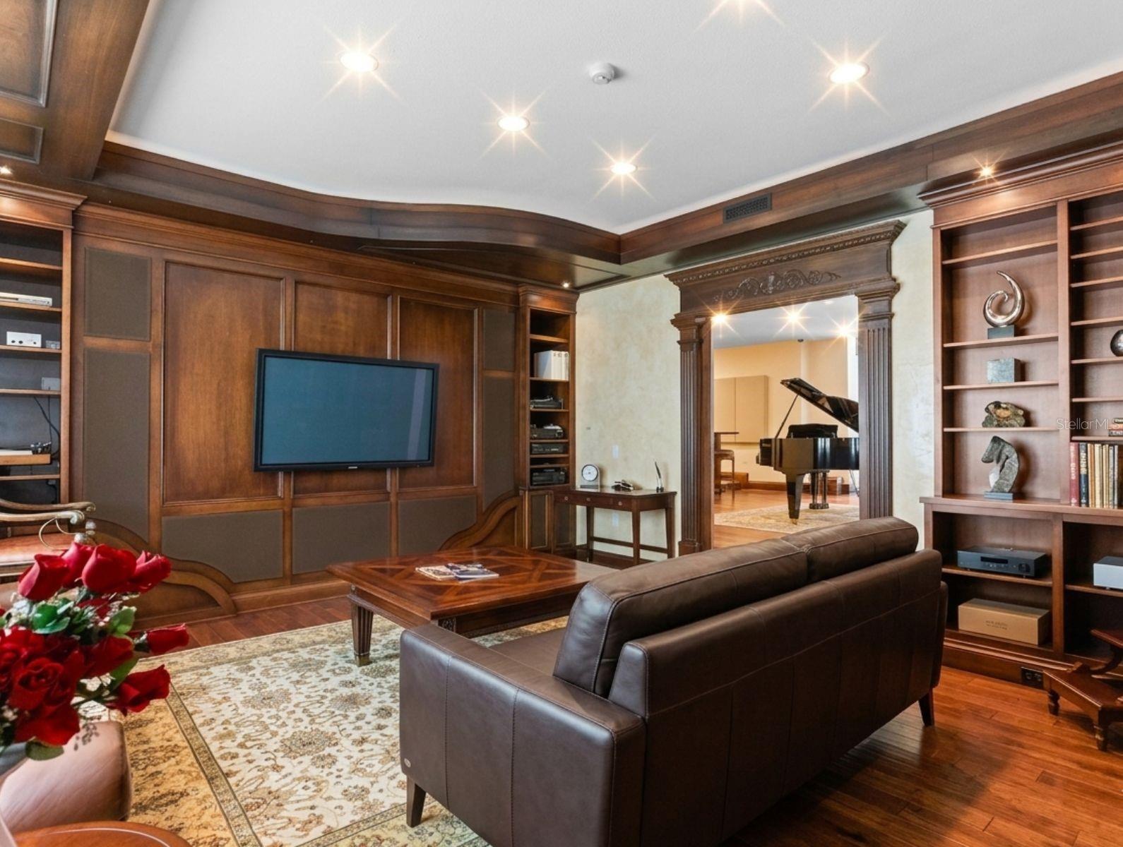 Inviting den with built in bookshelves and state of the art listening system so you can unwind with your favorite book or vinyl.