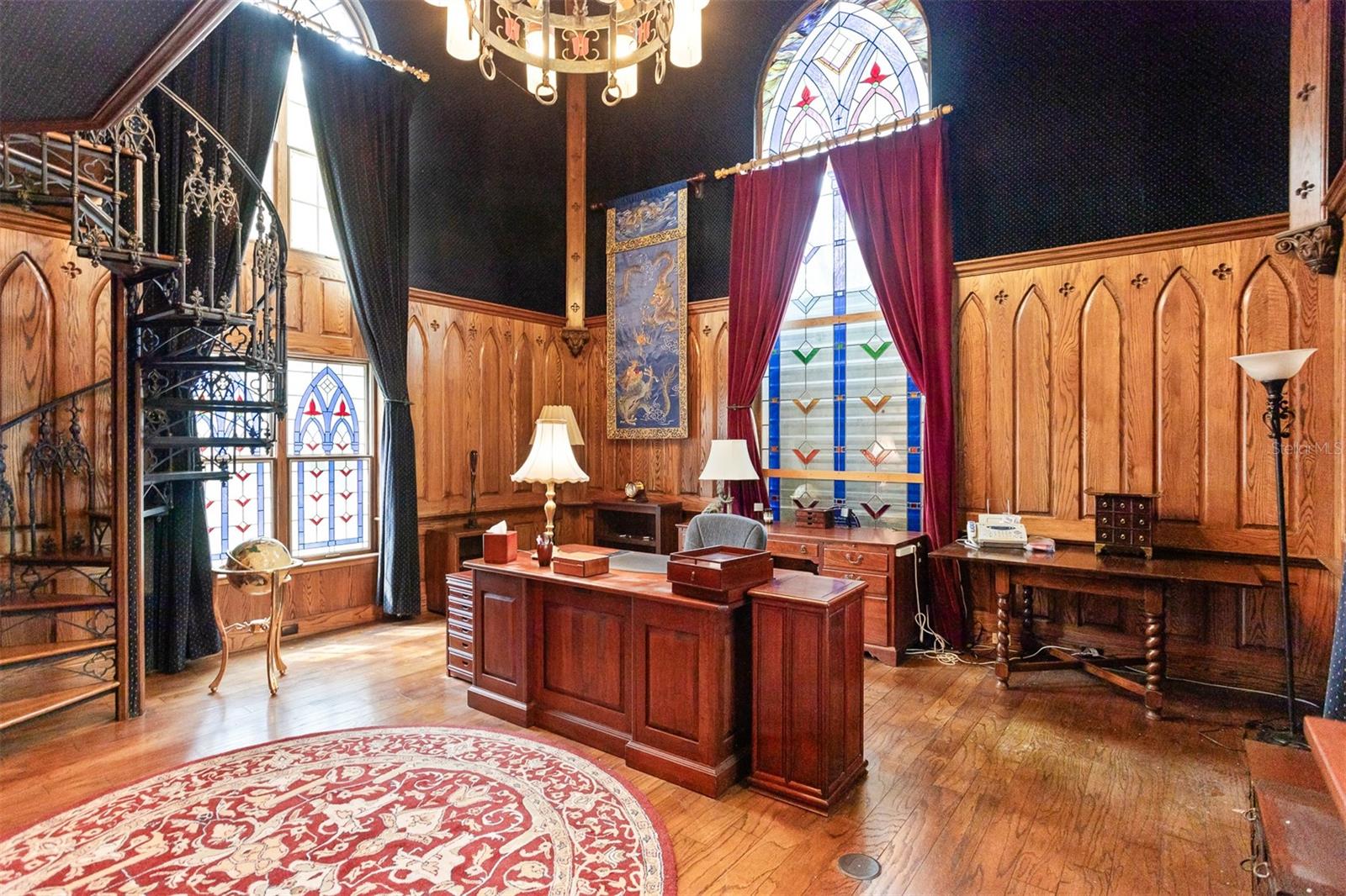 Experience unforgettable moments in this customized, majestic office, adorned with stunning stained glass windows that bathe the room in color and light.