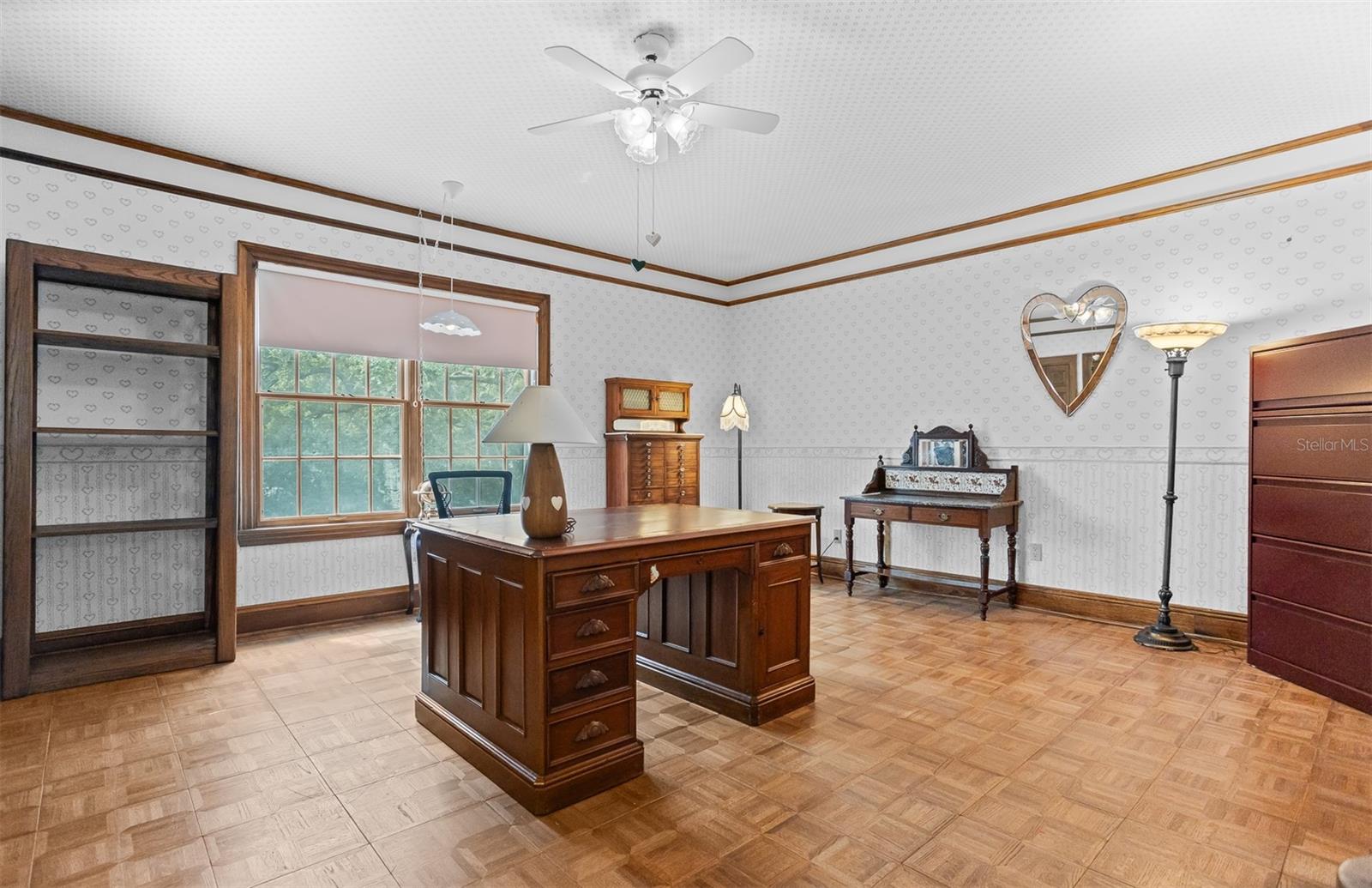 This Bright Bedroom is currently used as an Office