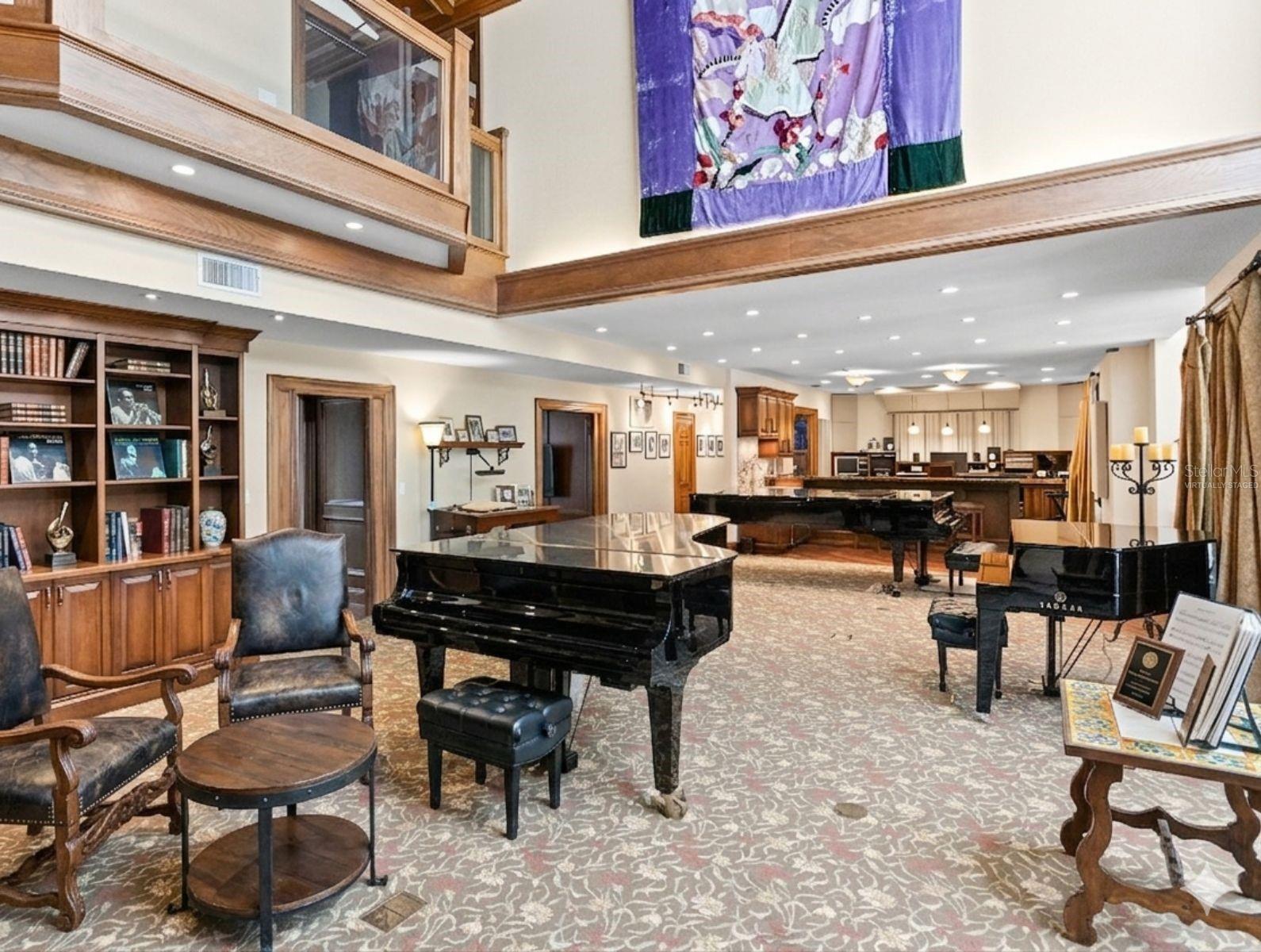 From the second floor balcony you have a stunning vantage point over the grand room where soaring ceilings and rich acoustics create a captivating atmosphere. Virtually Staged.