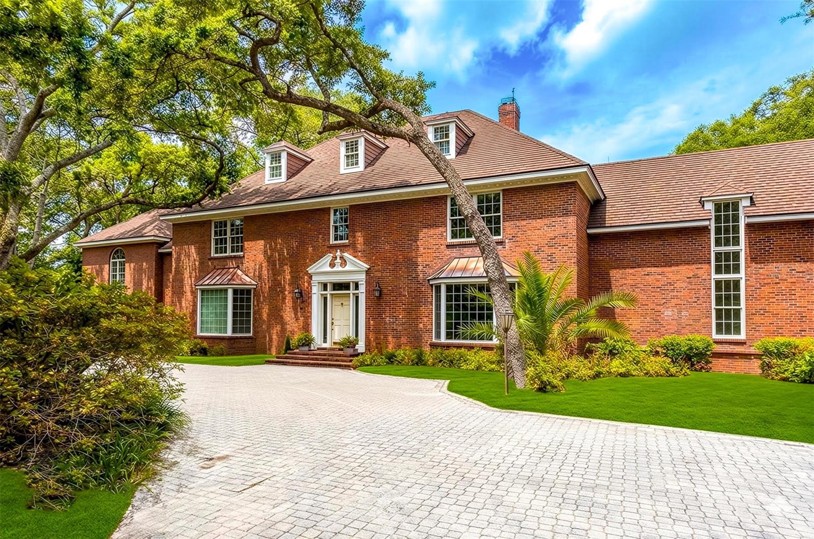 Beautiful Brick Home is tucked proudly at the end of a long driveway, virtually staged