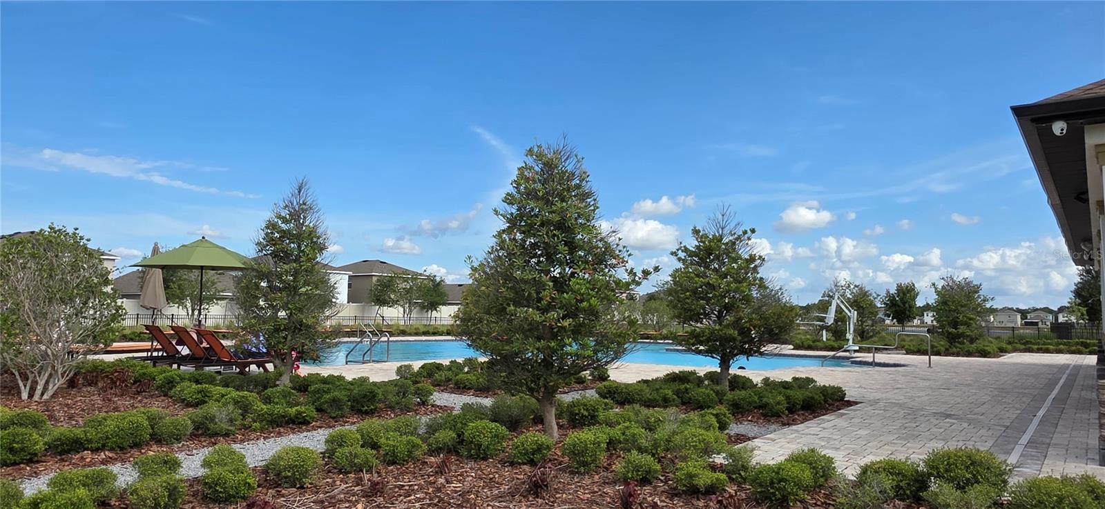 Community Pool, Lots of space, seating, Covered Area with Tables and Chairs, as well as Restrooms