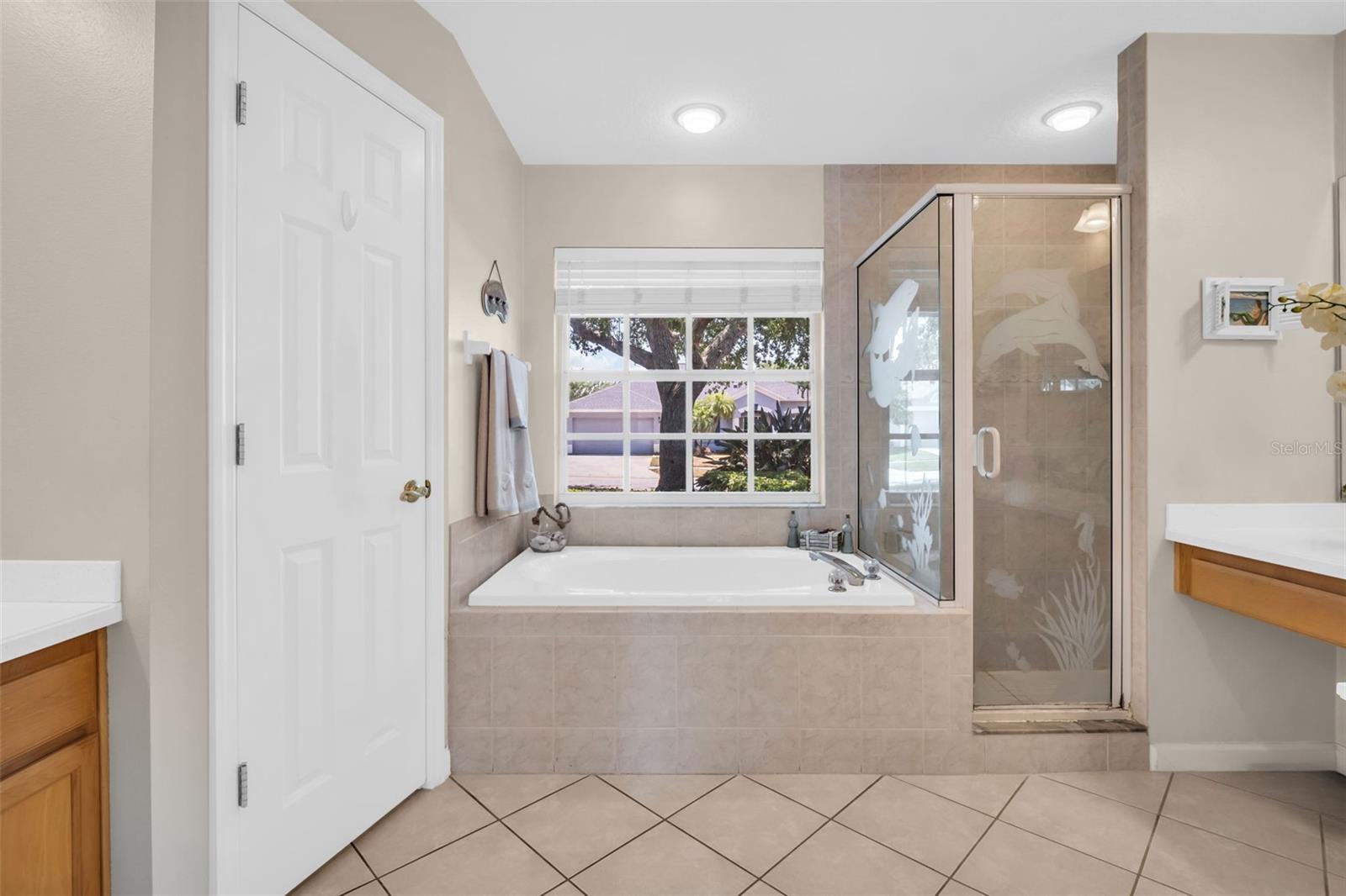 Deep soaking garden tub, separate walk-in shower, & dual vanities~