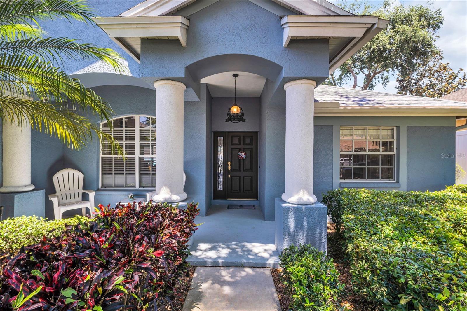 Gracious & welcoming front entry with patio space for seating~