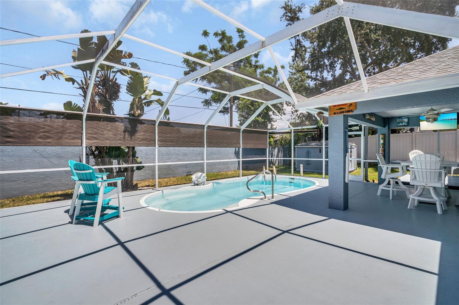 Freshly painted pool deck, fully screened, and full privacy fence~