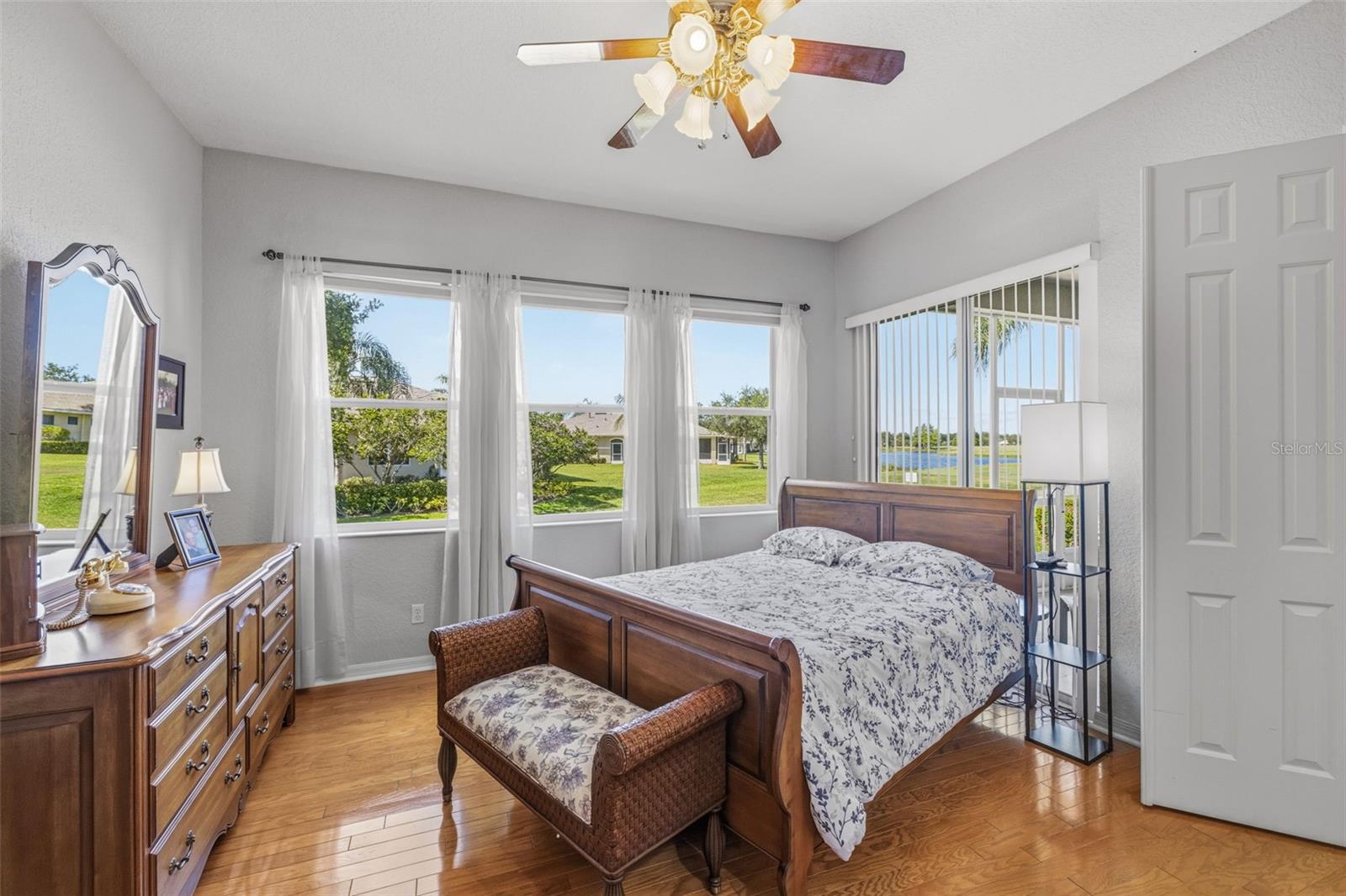 Primary bedroom with high ceilings and lots of natural light