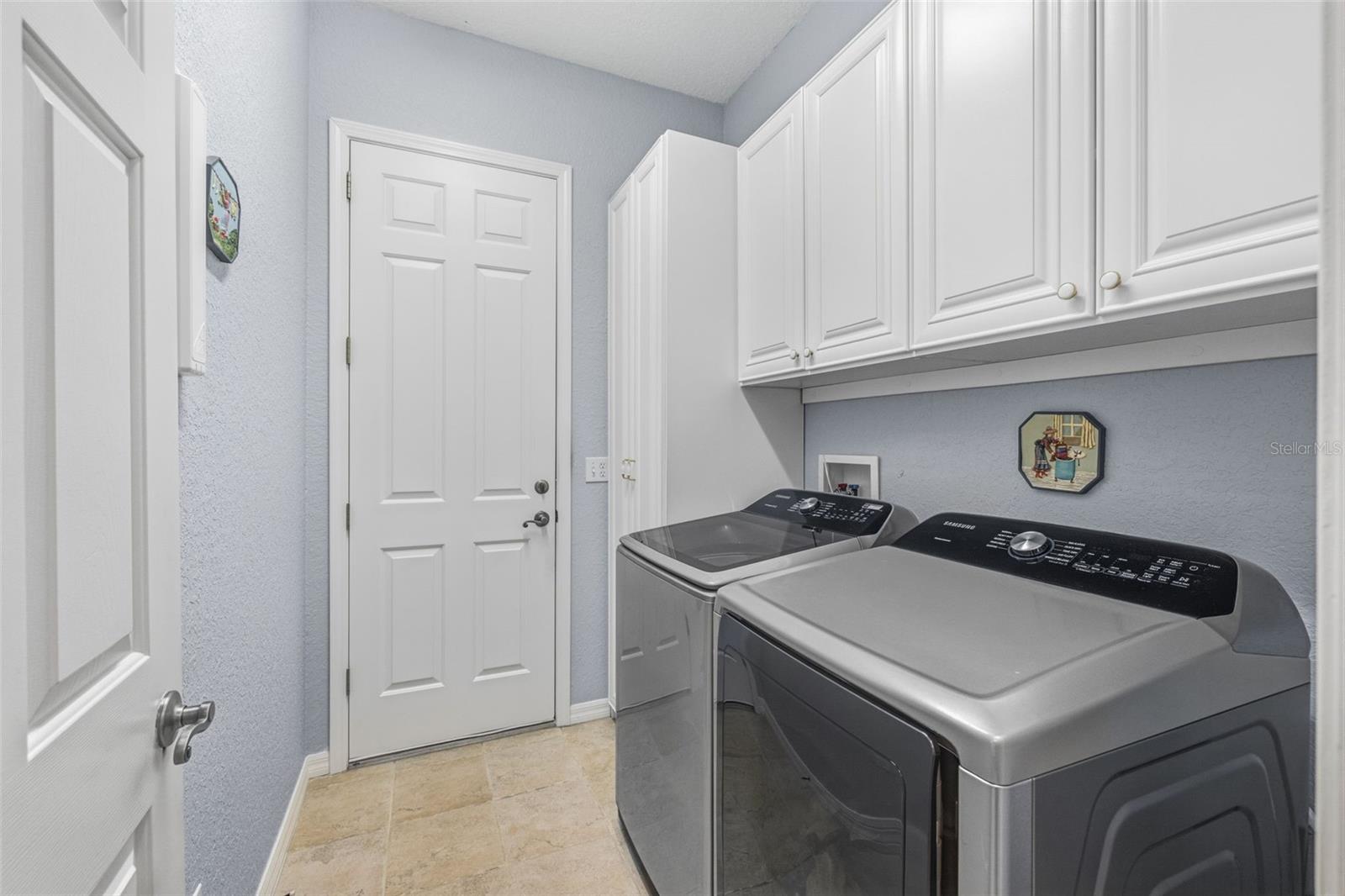 Spacious laundry room with extra storage