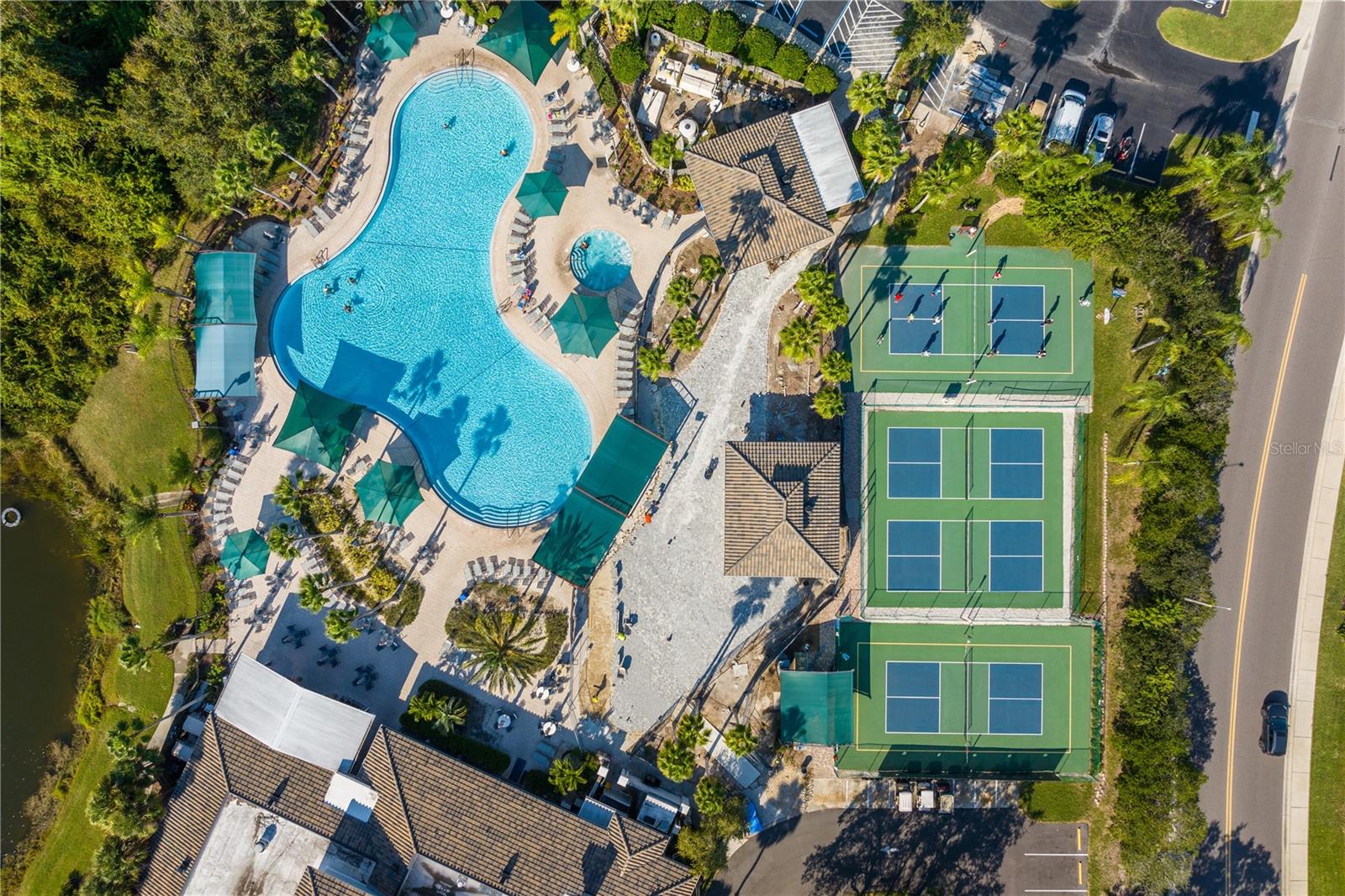 South Club resort style pool and courts now used for corn hole, volleyball and basketball