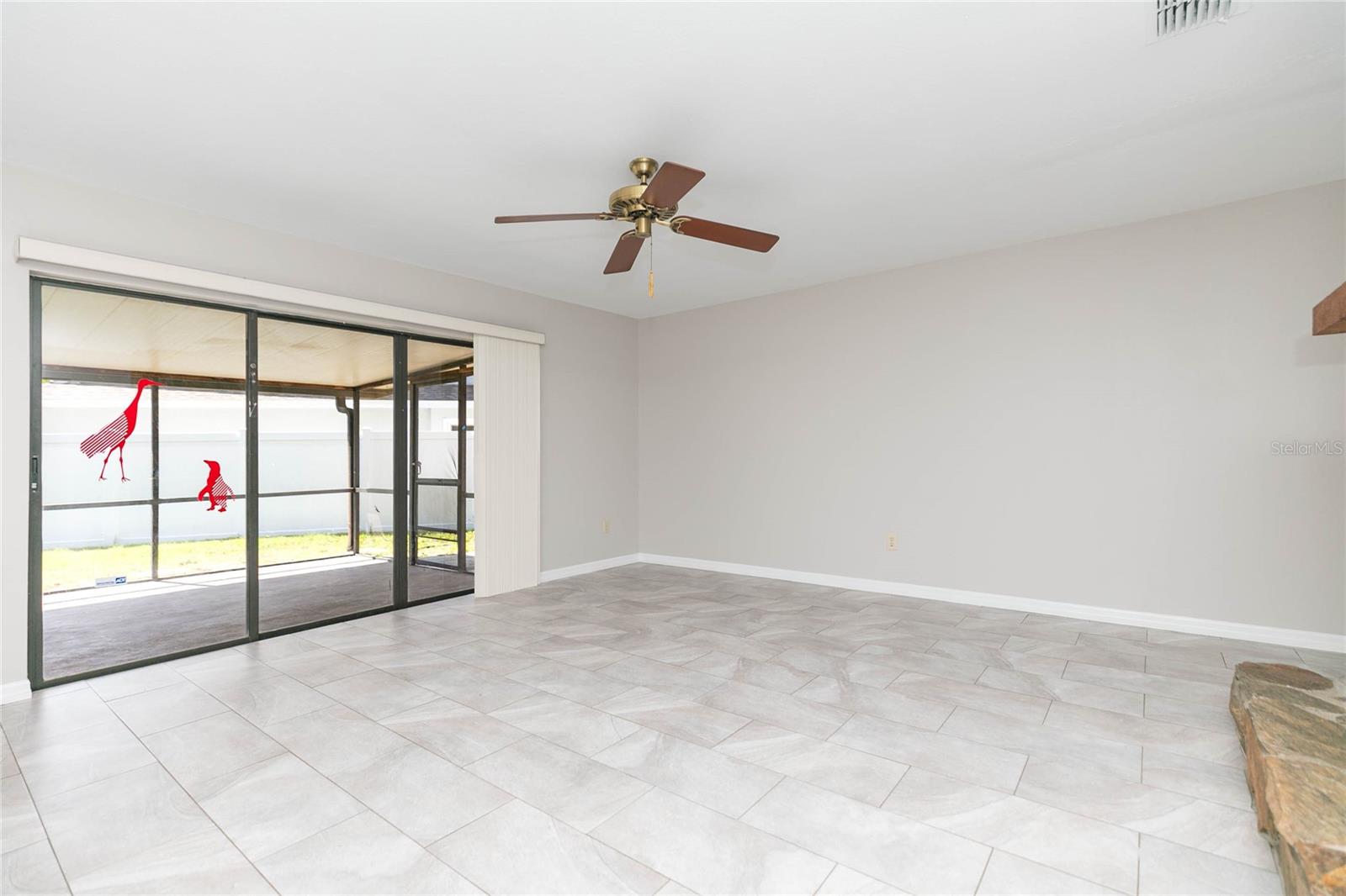 Triple sliders to the oversized and covered lanai