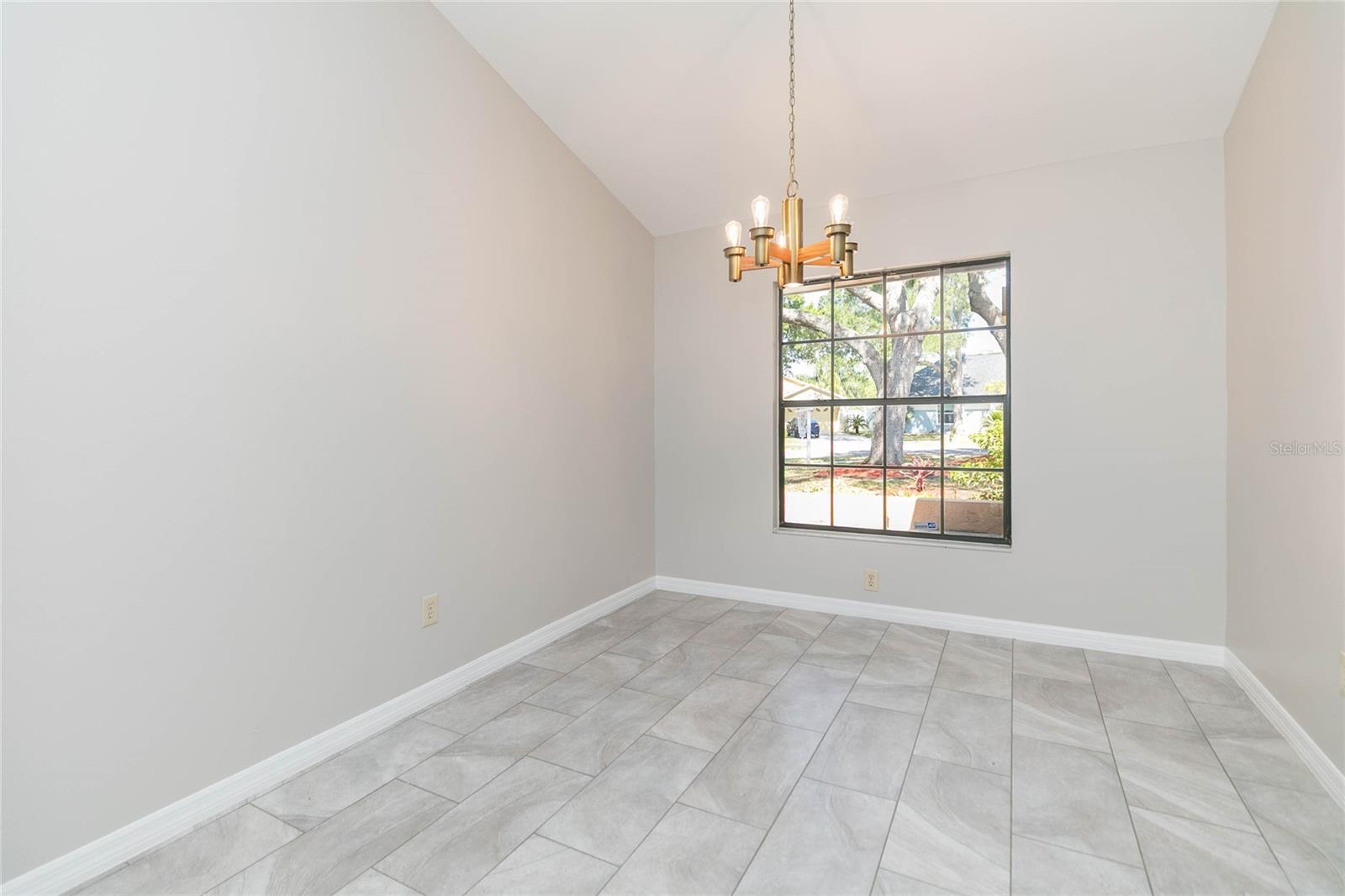 Formal dining room with large window to the front