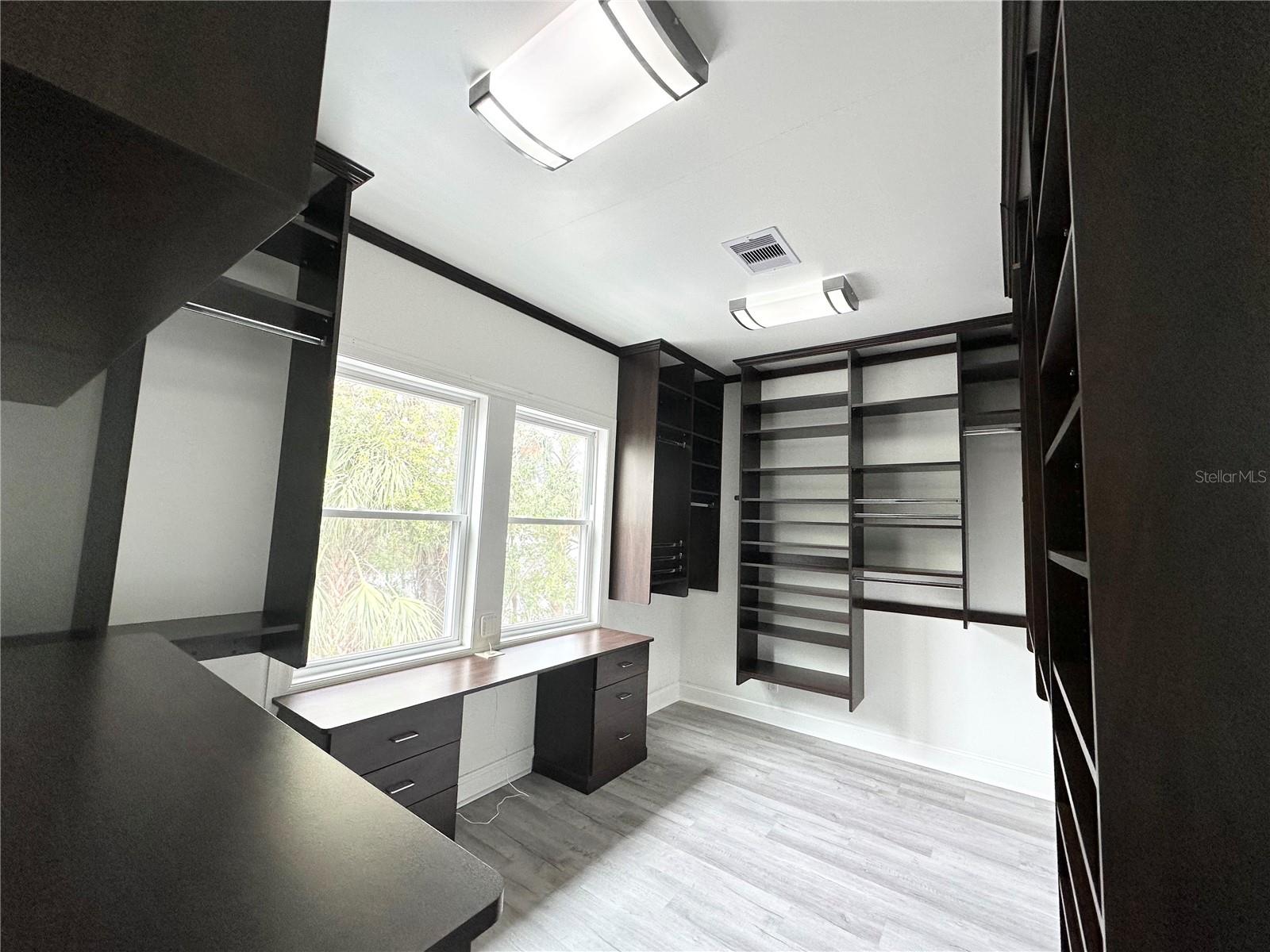 Primary closet with desk area