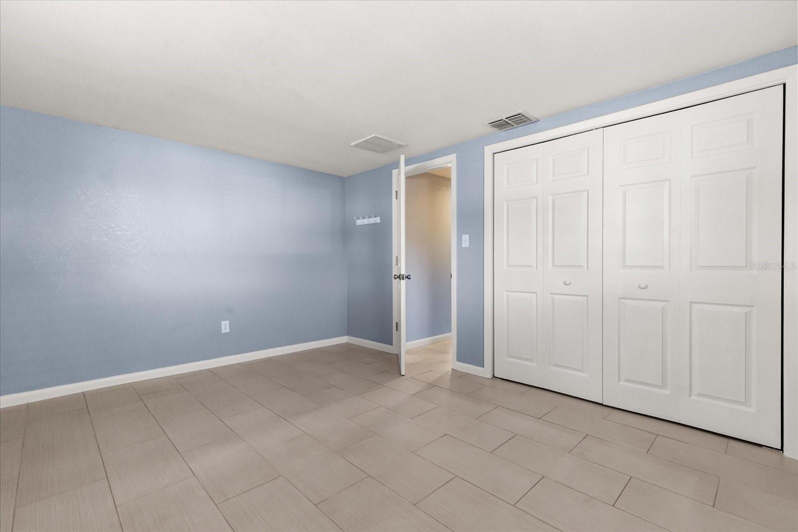 BEDROOM 1 WITH NEW BIFOLD CLOSET DOORS