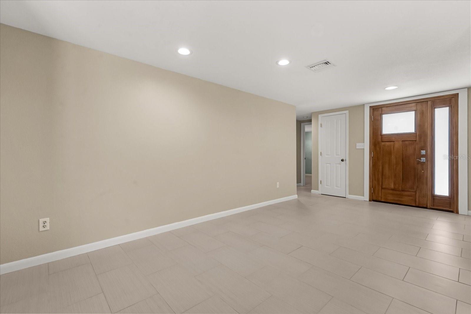 LIVING ROOM AND FOYER