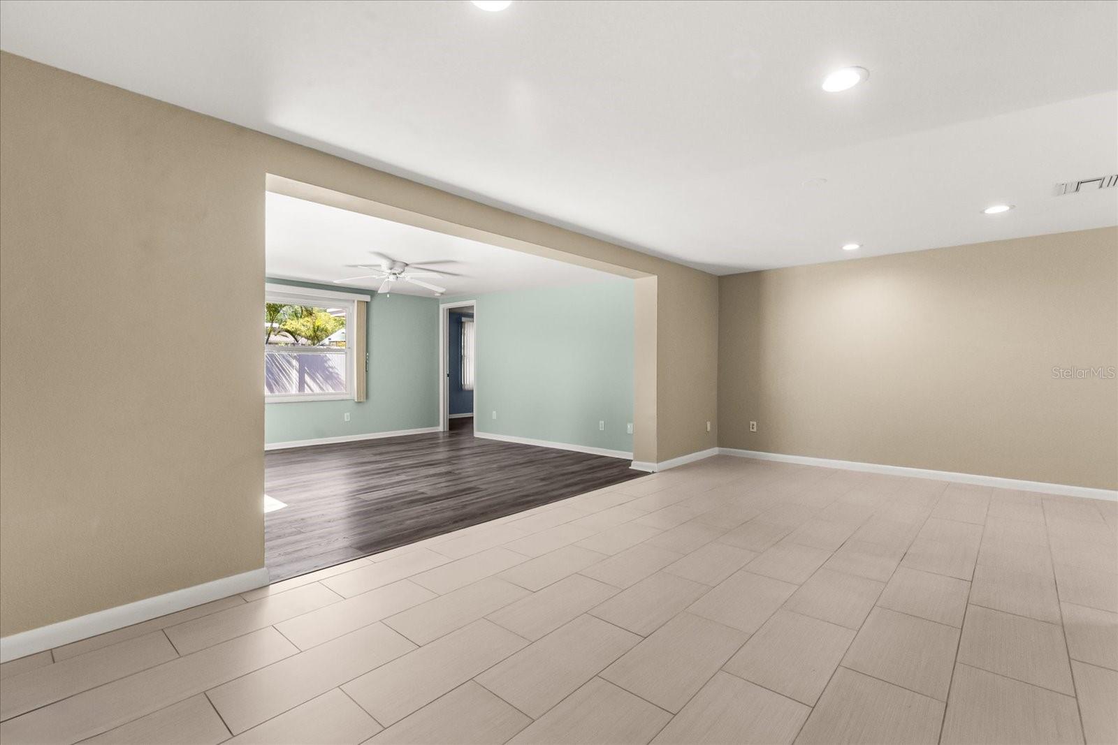 DINING/LIVING LOOKING INTO FAMILY ROOM
