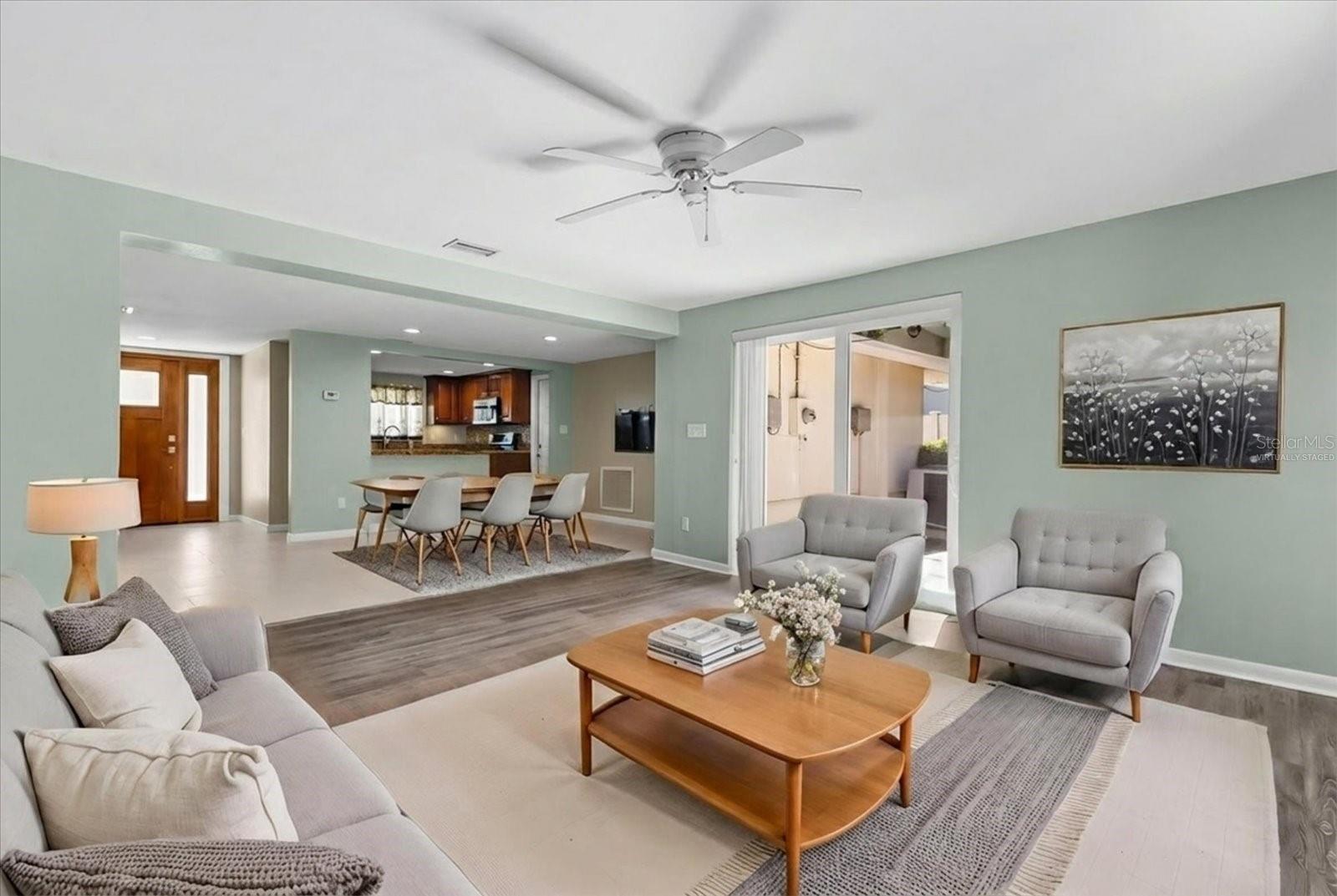 VIRTUALLY STAGED FAMILY ROOM LOOKING INTO DINING